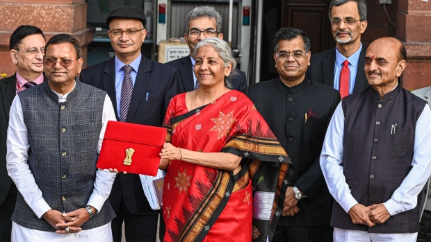 Nirmala Sitharaman, India's finance minister, center, and other members of the finance ministry leave the ministry to present the budget at the parliament in New Delhi, India, on Wednesday, Feb. 1, 2023. Sitharaman will announce the last full-year budget before Prime Minister Narendra Modi seeks a third term in elections due in the summer of 2024.