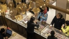 Customers shop for gold wear at a store in Shanghai. Photographer: Qilai Shen/Bloomberg