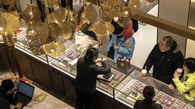 Customers shop for gold wear at a store in Shanghai. Photographer: Qilai Shen/Bloomberg