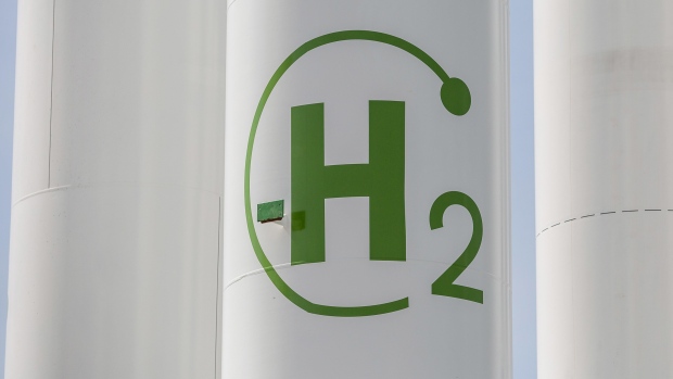 The chemical symbol for hydrogen on a storage tank during the final stages of construction at Iberdola SA's Puertollano green hydrogen plant in Puertollano, Spain, on Thursday, May 19, 2022. The new plant will be Europe's largest production site for green hydrogen for industrial use. Photographer: Angel Garcia/Bloomberg