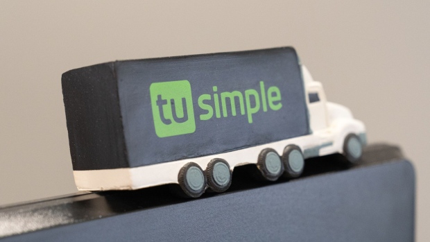 A model truck atop a desktop computer monitor inside TuSimple headquarters in the La Jolla neighborhood of San Diego, California, U.S., on Tuesday, April 27, 2021. TuSimple Holdings Inc., which is developing autonomous trucks now on the road in Texas and Arizona, closed unchanged in its trading debut after its initial public offering raised $1.35 billion. Photographer: Bing Guan/Bloomberg