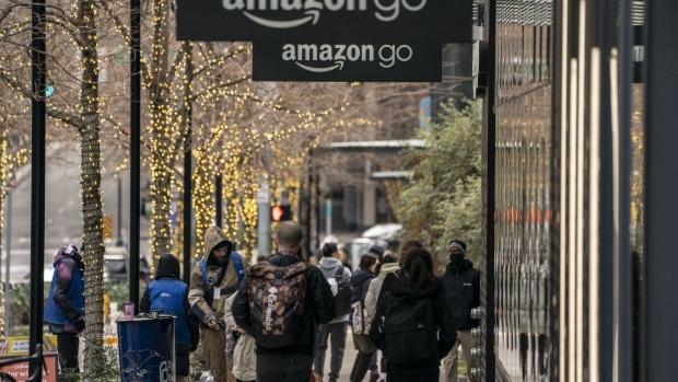 Signage outside an Amazon Go store at the company headquarters campus in the South Lake Union neighborhood of Seattle, Washington, U.S., on Thursday, Jan. 19, 2023. Amazon.com Inc. has started its biggest-ever round of jobs cuts a culling that will ultimately affect 18,000 workers around the globe. Photographer: David Ryder/Bloomberg