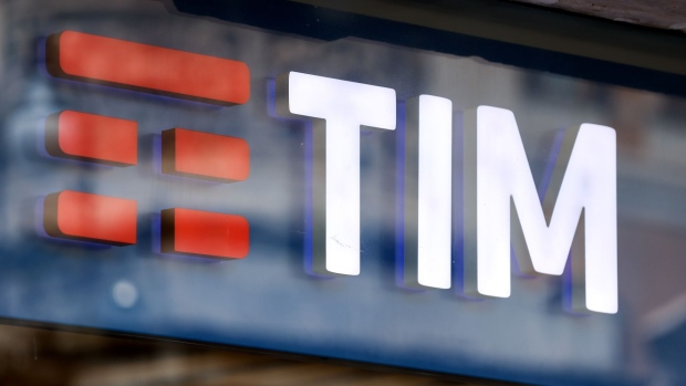 The Telecom Italia SpA logo in the window of a store in Rome, Italy, on Tuesday, May 31, 2022. Telecom Italia SpA is seeking an enterprise value of around 20 billion euros ($21.5 billion) for the landline network it plans to sell to Italy’s state lender and a group of international funds, according to people with knowledge of the matter. Photographer: Alessia Pierdomenico/Bloomberg