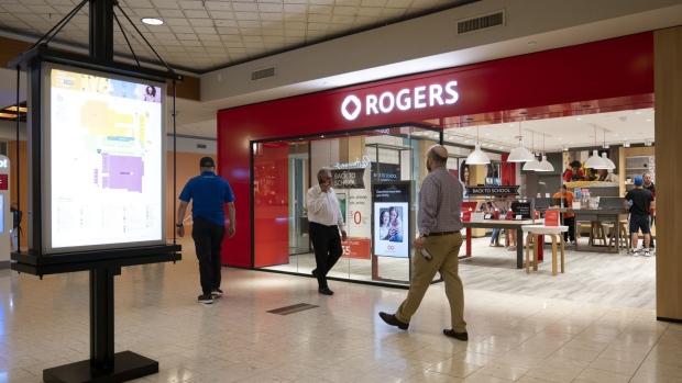 A Rogers store in the Capilano Mall in North Vancouver, British Columbia, Canada, on Tuesday, Sept. 6, 2022. Rogers Communications Inc. is still waiting to see if it can win regulatory approval for a takeover of a smaller Canadian cable company, 17 months after it was first announced. Photographer: Taehoon Kim/Bloomberg