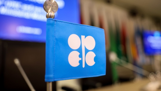 An OPEC-branded flag on a delegate desk ahead of the 33rd meeting of the Organization of Petroleum Exporting Countries (OPEC) and non-OPEC countries in Vienna, Austria, on Wednesday, Oct. 5, 2022. OPEC+ is considering its biggest production cut since 2020 as it tries to stabilize oil prices, a move that risks cranking up tensions with Washington. Photographer: Akos Stiller/Bloomberg