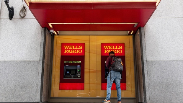 A customer uses an automated teller machine (ATM) at a Wells Fargo bank branch in San Francisco, California, U.S., on Monday, July 12, 2021. Wells Fargo & Co. is expected to release earnings figures on July 14.