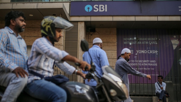 A State Bank of India Ltd. (SBI) branch in Mumbai, India, on Thursday, Feb. 2, 2023. SBI has given loans of as much as $2.6 billion to companies in the Adani conglomerate, or about half of what is allowed under the rules, according to a person familiar with the matter. Photographer: Dhiraj Singh/Bloomberg