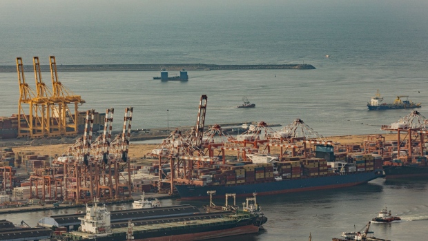 The site for the West Container Terminal, rear, and the East Container Terminal, center, in Colombo, Sri Lanka, on Wednesday, Oct. 26, 2022. Adani Ports and Special Economic Zone Ltd. was last year awarded the right to develop, build and operate the West Container Terminal.