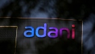Signage atop the Adani Group headquarters in Ahmedabad, India, on Wednesday, Feb. 1, 2023. 
    Bonds of the Indian billionaire’s flagship firm plunged to distressed levels in US trading, and the company abruptly pulled a record domestic stock offering after the Adani group suffered a $92 billion market crash. Photographer: Dhiraj Singh/Bloomberg