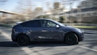 A Tesla Inc. Model Y electric vehicle leaves the automaker's showroom during a test drive in Shanghai, China, on Friday, Jan. 8, 2021. Tesla customers in China wanting to get the new locally made Model Y are facing a longer wait, signaling strong initial demand for the Shanghai-built SUV. Photographer: Qilai Shen/Bloomberg