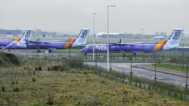 Grounded passenger aircraft featuring the Flybe Group Plc livery sit on the tarmac at Exeter Airport, Exeter, U.K., on Friday March 6, 2020. Flybe, Britain's biggest domestic airline, was placed in administration, a form of bankruptcy, on Thursday as the coronavirus epidemic ended prospects for a state-backed rescue.