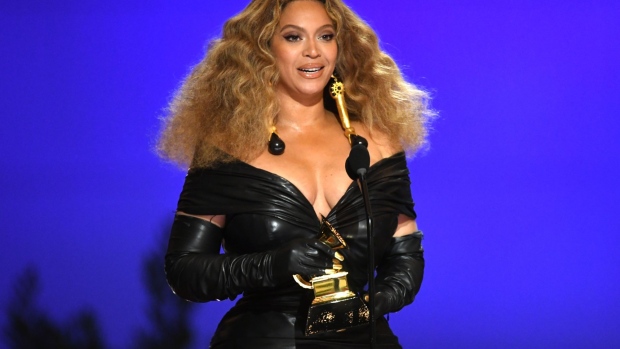 Beyoncé lifting a Grammy in 2021.(Photo by Kevin Winter/Getty Images for The Recording Academy) Photographer: Kevin Winter/Getty Images North America