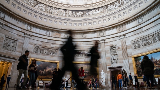 Visitors in the Rotunda of the U.S. Capitol in Washington, D.C., U.S., on Wednesday, March 30, 2022. Legislation to revoke Russia's regular trade status with the U.S. remains stalled as Democrats scramble to reach a deal with GOP Senators. Photographer: Eric Lee/Bloomberg