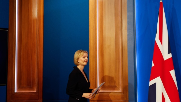 Liz Truss, UK prime minister, arrives for a news conference on the UK economy at Downing Street in London, UK, on Friday, Oct. 14, 2022. Truss fired Chancellor of the Exchequer Kwasi Kwarteng and replaced him with former Foreign Secretary Jeremy Hunt as she prepared to make a humiliating U-turn on parts of her economic plan.