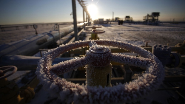 Ice sits on a valve control wheel connected to pipe work at a natural gas field in Russia.