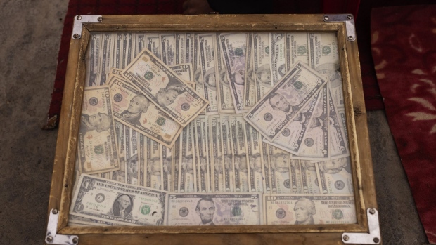 A wooden case holding US dollars bills on display at the Sara-e Shahzada exchange market in Kabul in October 2022.