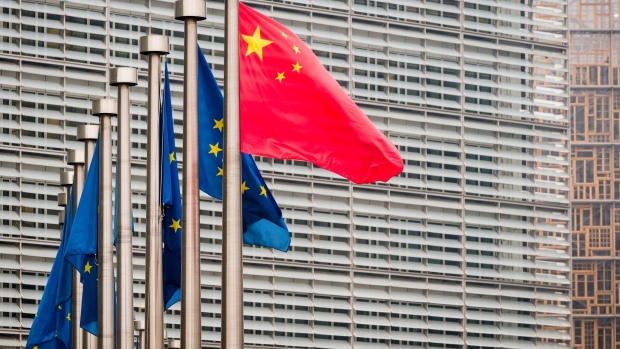 China’s national flag, left, flies beside European Union (EU) flags ahead of the EU-China summit in Brussels, Belgium, on Tuesday, April 9, 2019. The EU and China managed to agree on a joint statement for Tuesday’s summit in Brussels, papering over divisions on trade in a bid to present a common front to U.S. President Donald Trump, EU officials said. Photographer: Geert Vanden Wijngaert/Bloomberg