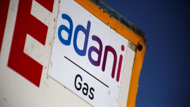 Signage of Adani Group gas station in Ahmedabad, India, on Wednesday, Feb. 1, 2023. Bonds of the Indian billionaire’s flagship firm plunged to distressed levels in US trading, and the company abruptly pulled a record domestic stock offering after the Adani group suffered a $92 billion market crash. Photographer: Dhiraj Singh/Bloomberg