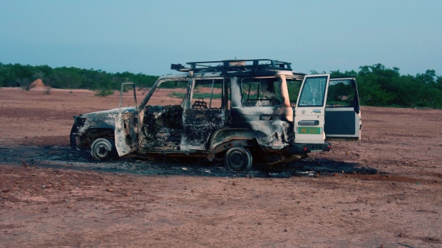 The wreckage of the car where six French aid workers, their local guide and the driver were killed by unidentified gunmen in southwestern Niger. Photographer: Boureima Hama/AFP