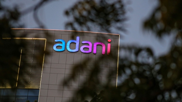 Signage atop the Adani Group headquarters in Ahmedabad, India, on Wednesday, Feb. 1, 2023. Bonds of the Indian billionaire’s flagship firm plunged to distressed levels in US trading, and the company abruptly pulled a record domestic stock offering after the Adani group suffered a $92 billion market crash.