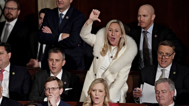 Representative Marjorie Taylor Green, a Republican from Georgia, center, gestures during a State of the Union address at the US Capitol in Washington, DC, US, on Tuesday, Feb. 7, 2023. President Biden is speaking against the backdrop of renewed tensions with China and a brewing showdown with House Republicans over raising the federal debt ceiling.