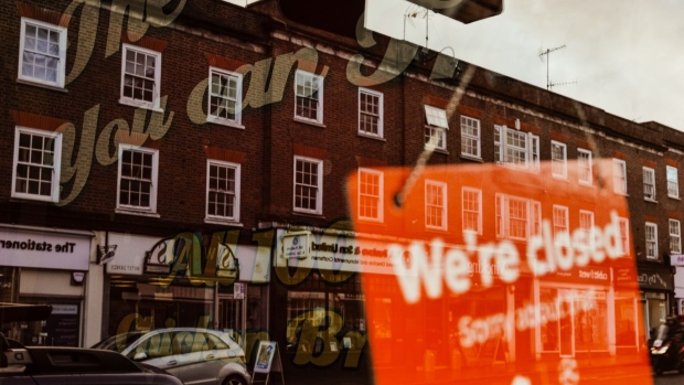 A sign reading "We're Closed" in the window of a restaurant on the high street in Reigate, UK, on Wednesday, Nov. 16, 2022. UK inflation rose more than expected to a 41-year high of 11.1%, adding to pressure on the Bank of England to raise interest rates again. Photographer: Jose Sarmento Matos/Bloomberg