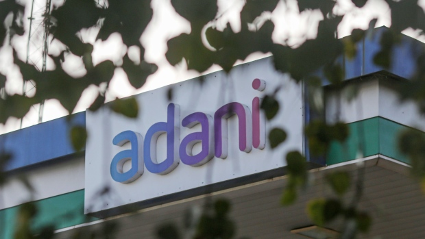 Signage of Adani Group at company's gas station in Ahmedabad, India, on Wednesday, Feb. 1, 2023. Bonds of the Indian billionaire’s flagship firm plunged to distressed levels in US trading, and the company abruptly pulled a record domestic stock offering after the Adani group suffered a $92 billion market crash. Photographer: Dhiraj Singh/Bloomberg