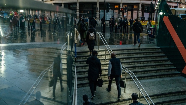 Morning commuters exit Liverpool Street railway station in the City of London.