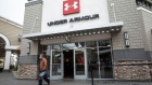 A customer exits an Under Armour store in Livermore, California, U.S., on Tuesday, Feb. 9, 2021. Under Armour Inc. is scheduled to release earnings figures on February 10.