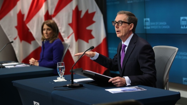 Tiff Macklem, governor of the Bank of Canada, speaks during a news conference with Carolyn Rogers, senior deputy governor of the Bank of Canada, left, in Ottawa, Ontario, Canada, on Wednesday, Jan. 25, 2023. The Bank of Canada raised interest rates for an eighth consecutive and potentially final time, saying it expects to move to the sidelines and weigh the impact of its rapid tightening.