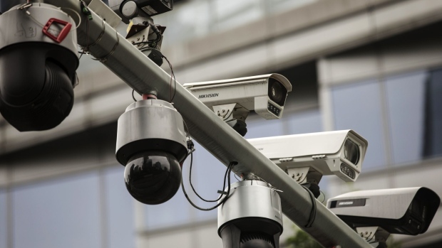 Surveillance cameras manufactured by Hangzhou Hikvision Digital Technology Co. are mounted on a post at a testing station near the company's headquarters in Hangzhou, China, on Tuesday, May 28, 2019. Hikvision, which is controlled by the Chinese government, is one of the leaders in the market for surveillance technology, with cameras that can produce sharp, full-color images in fog and near-total darkness. Photographer: Qilai Shen/Bloomberg