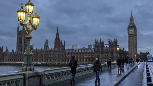 Commuters cross Westminster Bridge in view of the Houses of Parliament in London, UK, on Monday, Jan. 16, 2023. The Office of National Statistics will release the latest labour market figures on Tuesday. Photographer: Jason Alden/Bloomberg