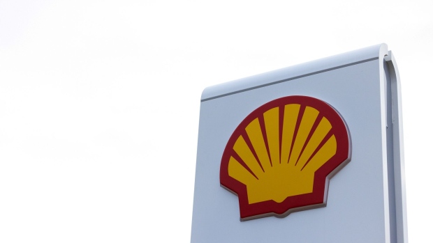 The Shell Plc company logo on a totem sign at the entrance to a petrol station in Billericay, UK, on Wednesday, Feb. 1, 2023. Shell posted a fourth-quarter profit that was well ahead of expectations as its natural gas business thrived, lifting the oil major to a record performance in 2022 fueled by soaring energy prices. Photographer: Chris Ratcliffe/Bloomberg