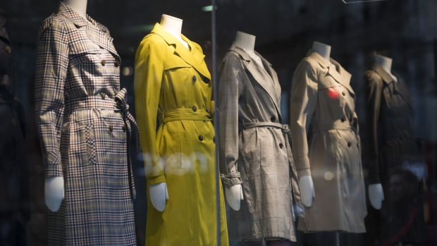 Mannequins display ladies trench coats for sale in the window display of a Debenhams Plc department store on Oxford Street in central London, U.K., on Monday, Feb. 4, 2019. Struggling U.K. department-store chain Debenhams, which issued three profit warnings last year, is planning for a company voluntary arrangement that could take place in the next few weeks, the Financial Times reported, citing three people familiar with the plans.