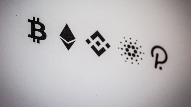 The Bitcoin, Ethereum, Binance Coin, Cardano, and Polkadot logos, left to right, inside a cryptocurrency exchange in Barcelona, Spain, on Wednesday, March 9, 2022. Bitcoin dropped back below $40,000, erasing almost all the gains sparked by optimism about U.S. President Joe Biden’s executive order to put more focus on the crypto sector. Photographer: Angel Garcia/Bloomberg