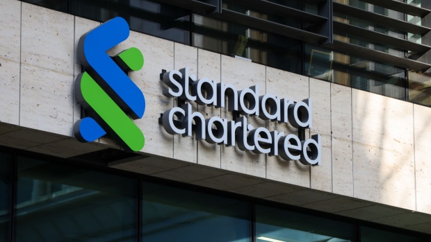 A Standard Chartered Plc logo at their headquarters in London, UK, on Thursday, Feb. 9, 2023. First Abu Dhabi Bank PJSC is pressing ahead with a potential offer for Standard Chartered Plc, after a move to put earlier takeover plans on hold didn’t halt its ambitions to become a global financial powerhouse.