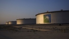 A company logo sits on the side of a crude oil storage tank at the Juaymah tank farm at Saudi Aramco's Ras Tanura oil refinery and oil terminal in Ras Tanura, Saudi Arabia, on Monday, Oct. 1, 2018. Saudi Aramco aims to become a global refiner and chemical maker, seeking to profit from parts of the oil industry where demand is growing the fastest while also underpinning the kingdom’s economic diversification. Photographer: Simon Dawson/Bloomberg