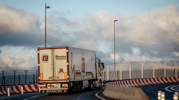 A haulage truck on an access road near the channel tunnel, operated by Getlink SE, in Calais, France, on Thursday, Dec. 31, 2020. With Britain’s departure from the single market come a host of regulations and customs paperwork that threaten to gum up the free flow of trade and add costs for importers and exporters on both sides of the split. Photographer: Cyril Marcilhacy/Bloomberg