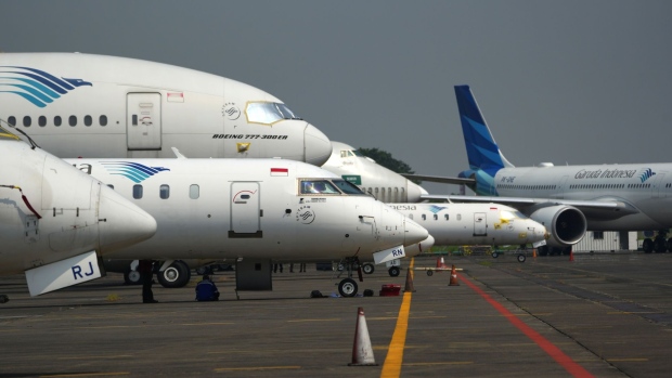 PT Garuda Indonesia aircraft outside a hangar at the company's maintenance facility at Soekarno-Hatta International Airport in Cengkareng, Indonesia, on Thursday, June 30, 2022. Garuda could post an operating profit next year after renegotiating its aircraft leases and focusing more on the domestic market, according to the government official in charge of its restructuring. Photographer: Dimas Ardian/Bloomberg