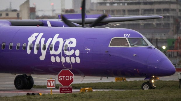 A passenger aircraft, operated by Flybe Group Plc, taxis along the tarmac at London City Airport in London, U.K., on Tuesday, Jan. 14, 2020. U.K. regional airline Flybe has only days to secure a rescue package that could include help from the government, according to a person with knowledge of the talks.