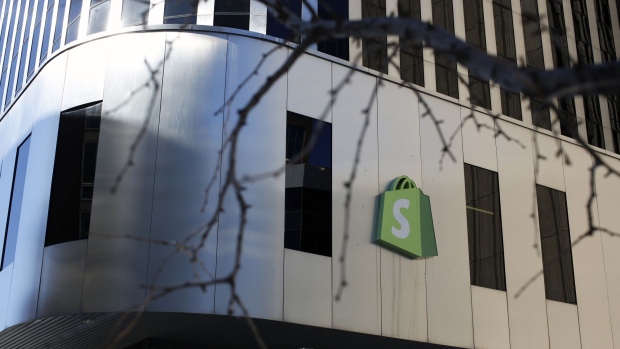 A logo outside Shopify headquarters in Ottawa, Ontario, Canada, on Tuesday, Feb. 14, 2023. Shopify Inc. was among the first technology giants to slash its workforce during last year’s market rout. Now, some investors say its stock is poised to outperform peers over the course of 2023 as those job cuts translate into lower costs, narrower losses and better cash flow.