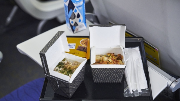 A meal is served during a media event for Scoot, a unit of Singapore Airlines Ltd., at Changi Airport in Singapore, on Thursday, Nov. 26, 2020. Singapore Airlines' low-cost carrier Scoot is introducing an inflight system called ScootHub that customers can access via their mobile devices for ordering food, drinks, duty-free and other services which will reduce surface contact and physical interaction between passengers and crew. Photographer: Lauryn Ishak/Bloomberg