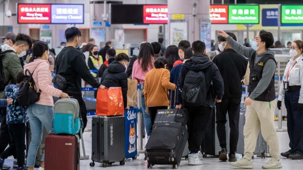 Travelers in the border control area at Hong Kong’s Lok Ma Chau station on Jan. 20, 2023.