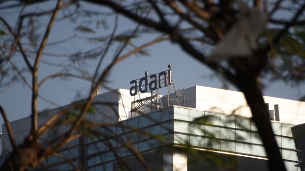 Signage of Adani Group in Mumbai, India, on Wednesday, on Feb. 15, 2023. Adani Group said it has adequate cash reserves and its listed companies are able to refinance their debts, in a credit report aimed at reassuring investors after a critical investigation by US short-seller Hindenburg Research last month.. Photographer: Indranil Aditya/Bloomberg