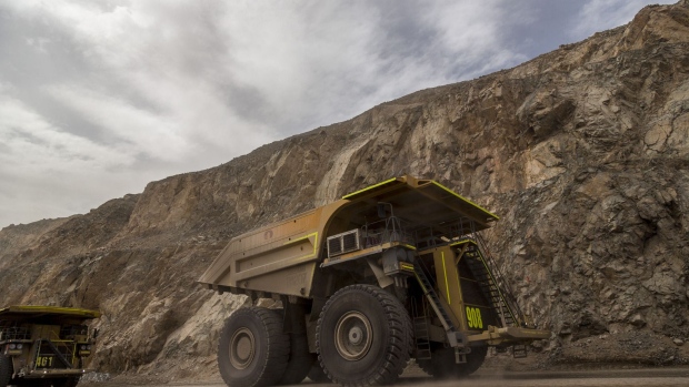 Trucks transport minerals inside the Codelco Chuquicamata open pit copper mine near Calama, Chile, on Thursday, Aug. 2, 2018. Protests at the Chuquicamata copper mine in late July were the first labor disruptions in Chile this year, and happened amid calls for a strike from the union at the world's largest mine, BHP Billiton Ltd.'s Escondida. Photographer: Cristobal Olivares/Bloomberg