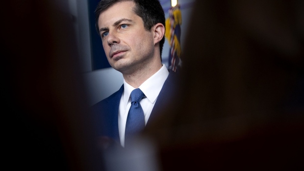 Pete Buttigieg, U.S. secretary of transportation, listens during a news conference in the James S. Brady Press Briefing Room at the White House in Washington, D.C., U.S., on Friday, April 9, 2021. The U.S. is expected to almost triple its wind and solar capacity over the next 10 years, but that still won't be enough to meet President Biden's goal of fully decarbonizing the country's power system by 2035.