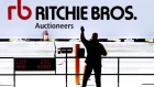 A ringman takes bids during a Ritchie Bros. Auctioneers industrial equipment auction in California. Photographer: Ken James/Bloomberg