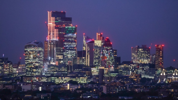 Skyscrapers and buildings on the City of London skyline at dusk.