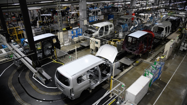 A Toyota Provox, front, and other vehicles on the production line at the Daihatsu Motor Kyoto plant. Photographer: Akio Kon/Bloomberg