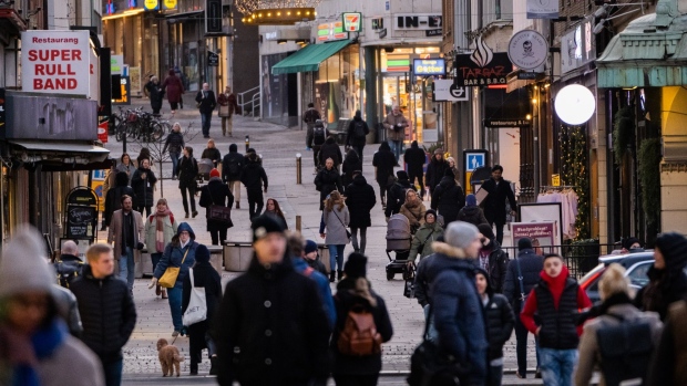 Shoppper walking along Kungsgatan shopping street, following the removal of coronavirus restrictions, in central Gothenburg, Sweden, on Wednesday, Feb. 9, 2022. Sweden will phase out the majority of its current pandemic support measures, with the decision coinciding with a lifting of most restrictions from Wednesday. Photographer: Nora Lorek/Bloomberg